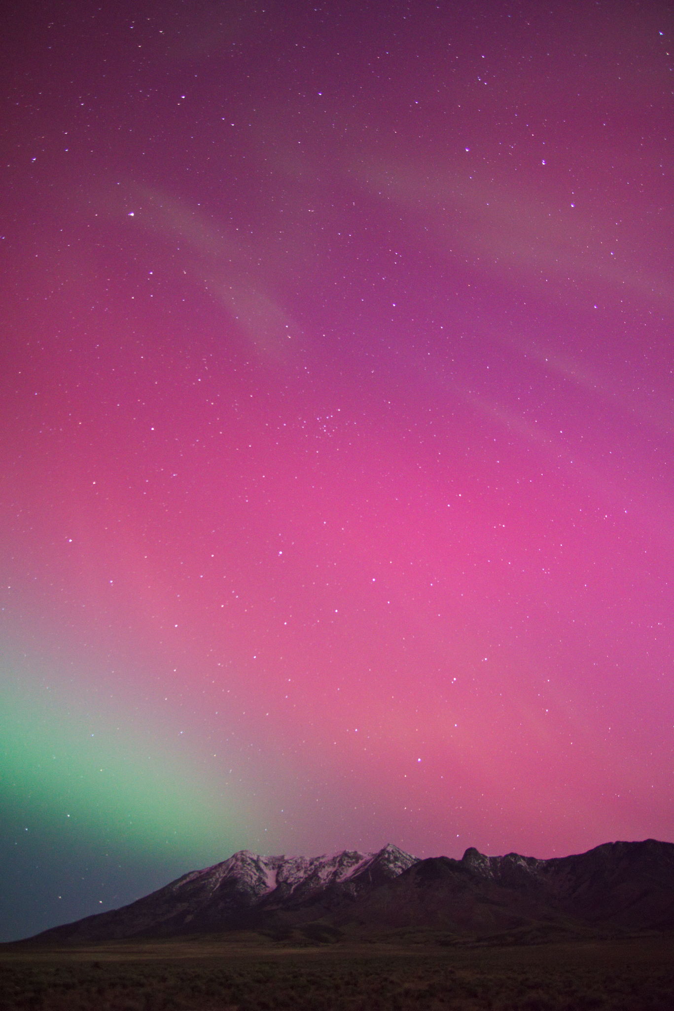 Green and pink aurora above Pilot Range