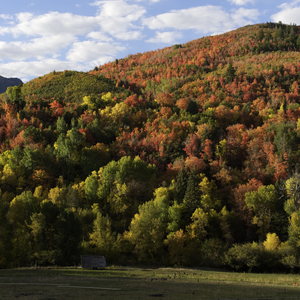 Sunrise light on mountain peaks and valley