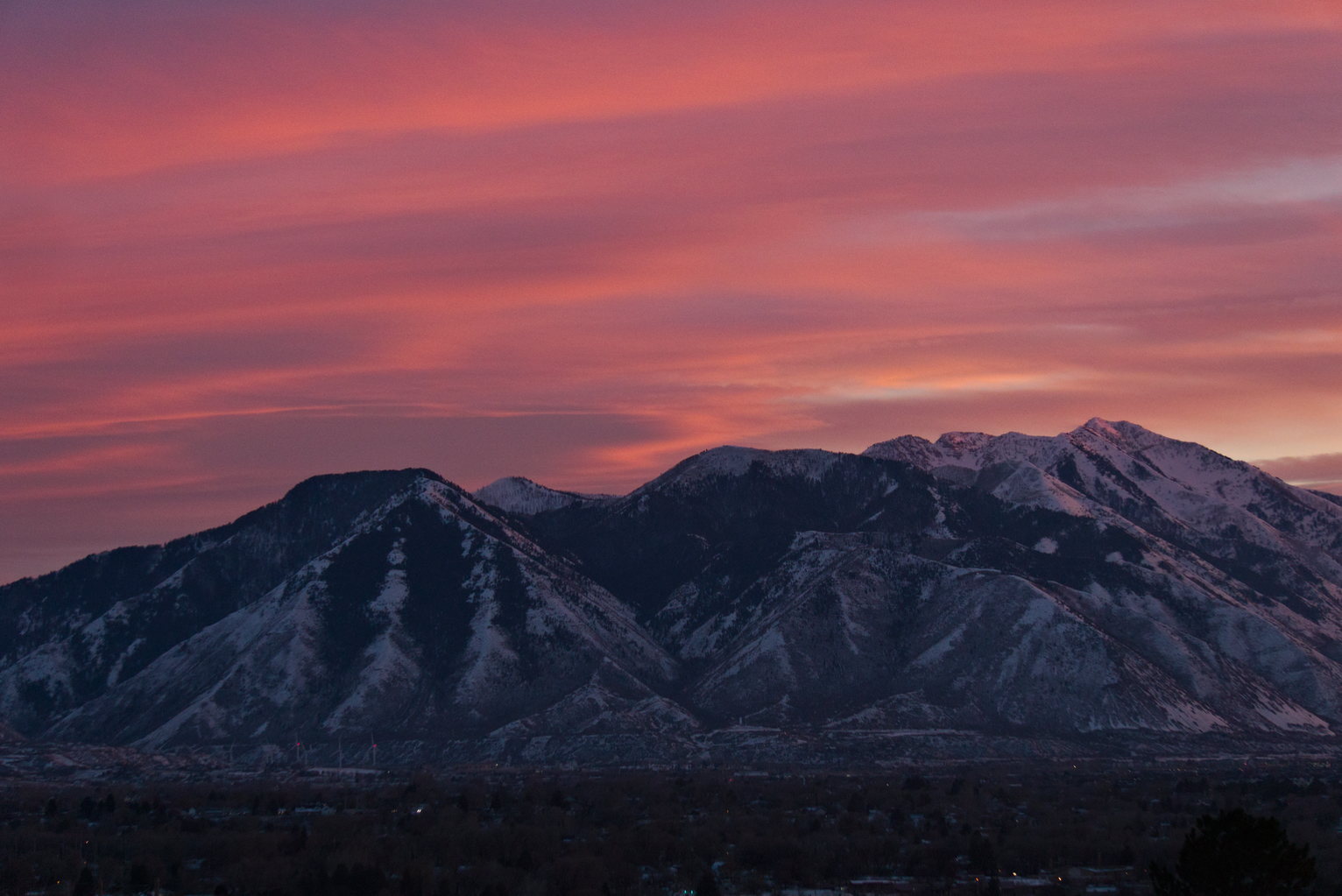 Pinky orange clouds glowing over mountains
