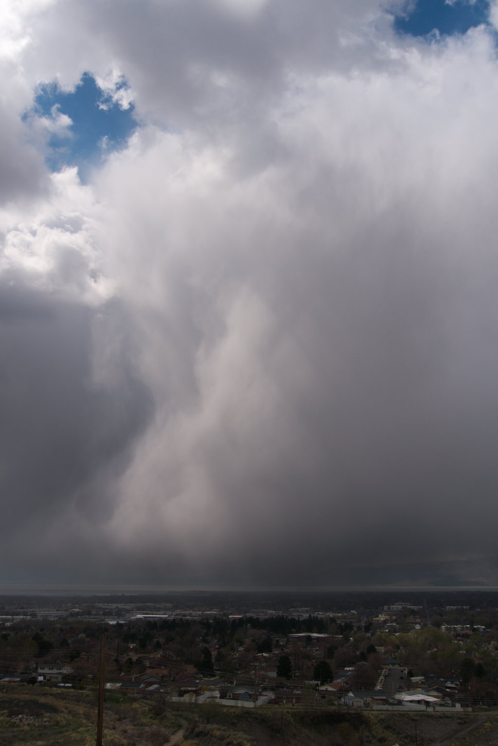 Silvery sheets of rain over town