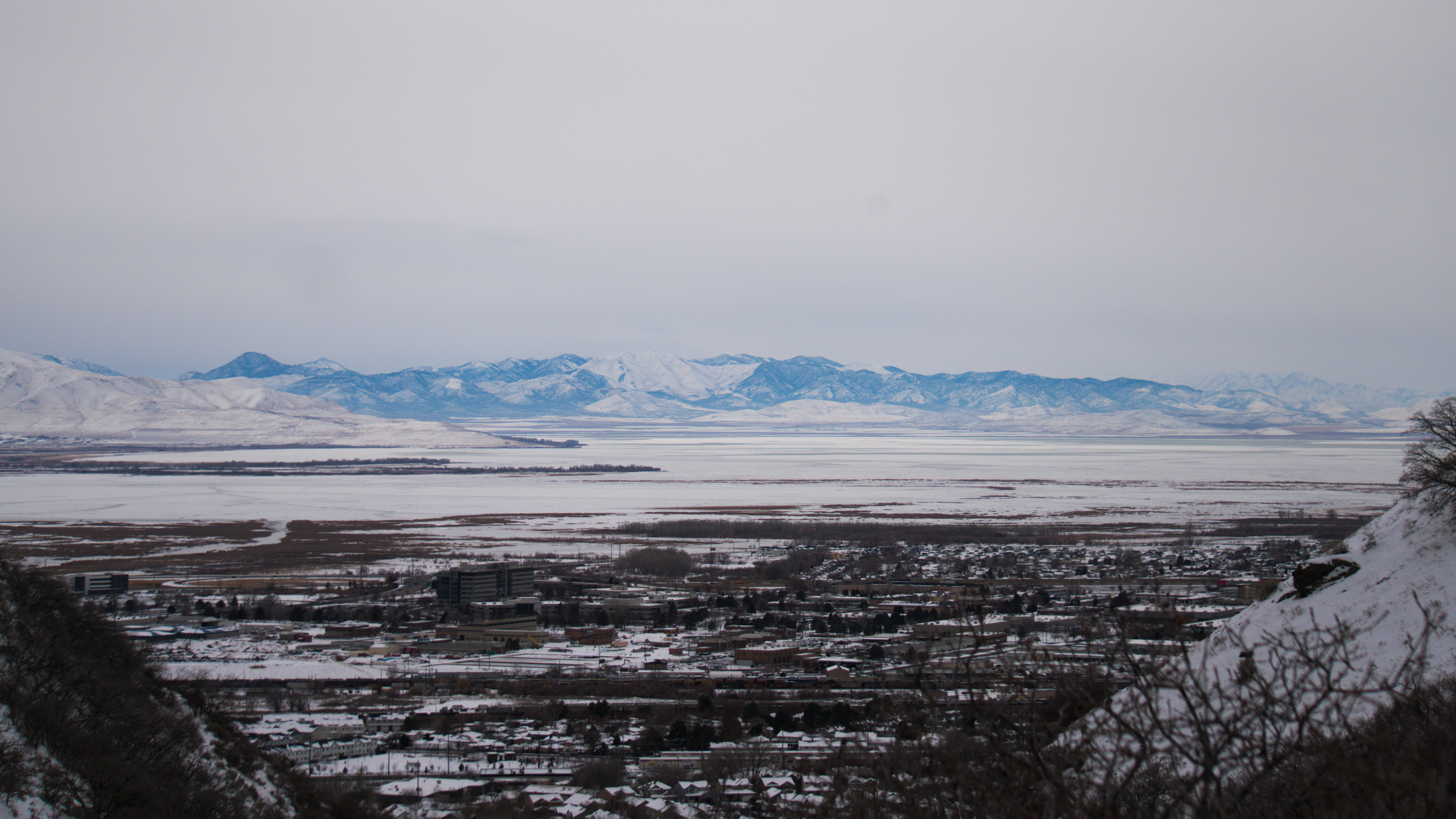 A snowy canyon with a rocky outcrop on the side