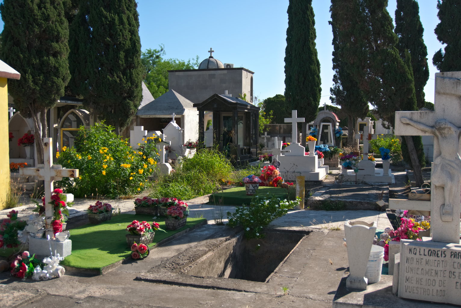 Flowers and trees abound bringing color to the cemetery