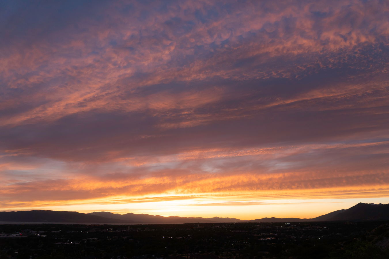 Sunset lit clouds, shadow streaks