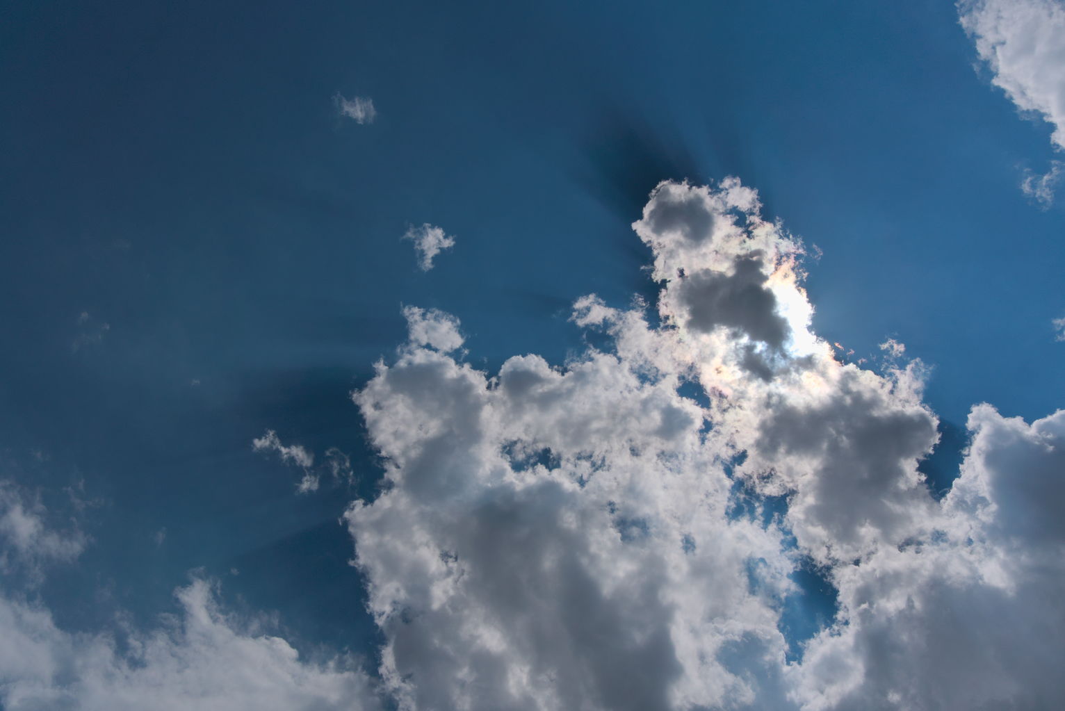 Clouds casting heavy shadows in the sky