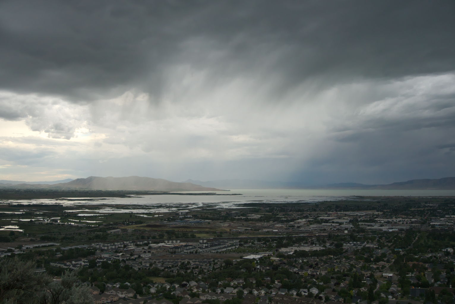 Rain falling over Utah Lake in a large sheet