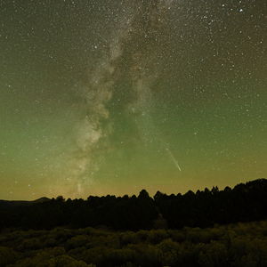 C/2023 A3 with Milky Way in chartreuse sky over rubber rabbitbrush