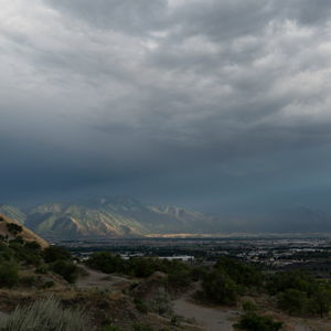 Sunshine lights the slopes of Loafer Mountain through a gap in the clouds